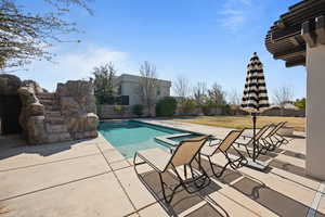 View of swimming pool featuring a patio area