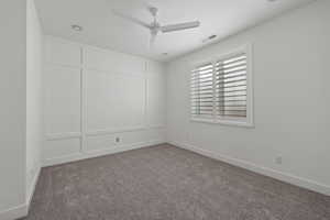 Unfurnished room with carpet floors and ceiling fan