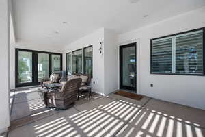 View of patio with an outdoor hangout area