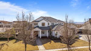 View of front property featuring a front lawn