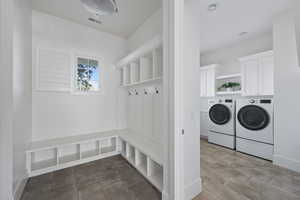 Mudroom featuring independent washer and dryer