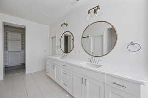 Bathroom with vanity and tile patterned floors