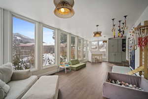 Sunroom with a mountain view