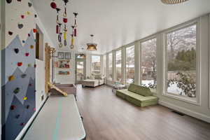 Unfurnished sunroom with visible vents