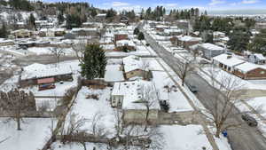 Snowy aerial view with a residential view