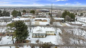 Snowy aerial view with a residential view