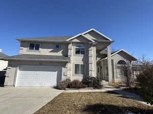 View of property featuring a garage