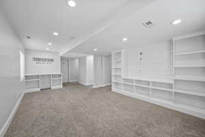 Carpeted empty room with recessed lighting, visible vents, and baseboards