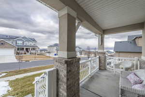 View of patio / terrace with a porch and a residential view