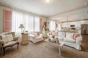 Living room with recessed lighting and a textured ceiling