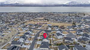 Aerial view featuring a residential view and a water and mountain view