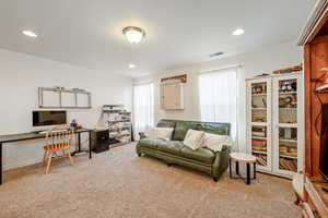 Office featuring carpet, visible vents, and recessed lighting