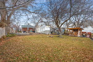 View of yard featuring fence