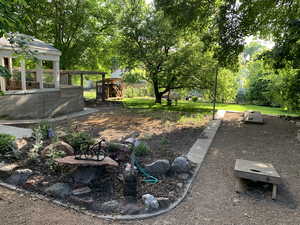 View of yard featuring fence