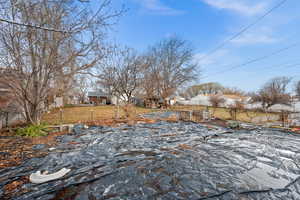 View of yard with a residential view and fence