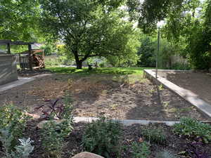 View of yard featuring fence