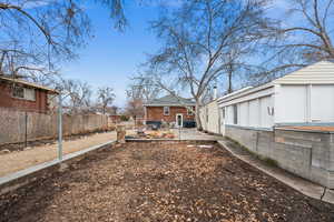 View of yard featuring fence