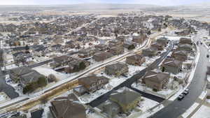 Snowy aerial view with a residential view