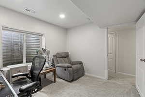 Home office featuring baseboards, recessed lighting, visible vents, and light colored carpet