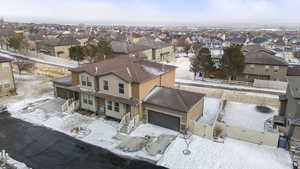 Snowy aerial view with a residential view