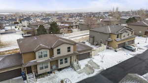 Snowy aerial view with a residential view