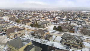 Snowy aerial view with a residential view