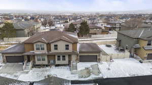 Snowy aerial view with a residential view