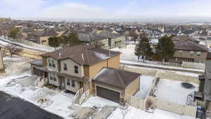 Snowy aerial view with a residential view