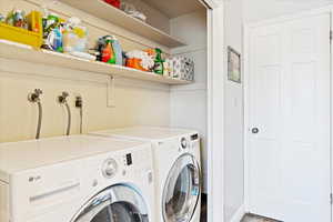 Washroom with laundry area and independent washer and dryer