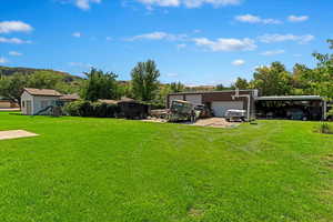 View of yard featuring a detached garage