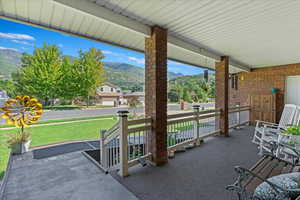 View of patio featuring a porch and a mountain view