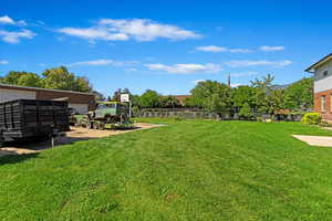 View of yard featuring fence