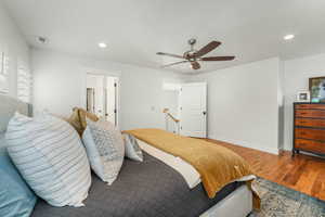 Bedroom featuring recessed lighting, visible vents, ceiling fan, wood finished floors, and baseboards