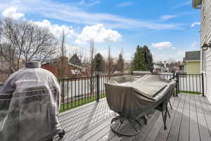 Deck featuring a grill and a residential view