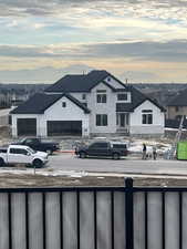 Exterior space with a residential view, a mountain view, and fence