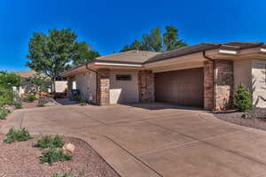 View of property exterior featuring a garage