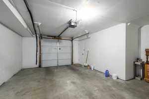 Garage featuring a garage door opener