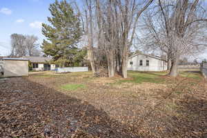 View of yard with fence