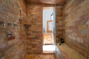 Full bathroom featuring tiled shower