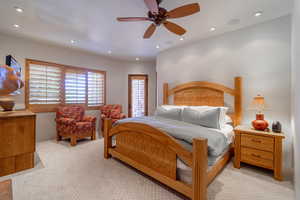 Bedroom with light carpet, a ceiling fan, and recessed lighting