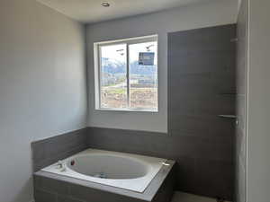 Full bath with a bath