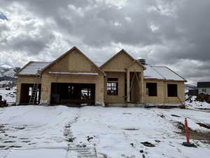 Property in mid-construction featuring a garage