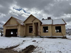 Property under construction featuring a garage