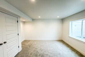 Unfurnished room featuring carpet floors, recessed lighting, and baseboards