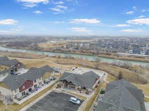 Drone / aerial view featuring a water view and a residential view