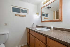 Bathroom with toilet and vanity