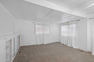 View of carpeted spare room