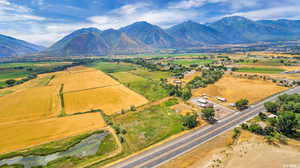 Birds eye view of property featuring a rural view and a mountain view