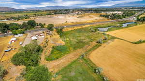 Aerial view featuring a rural view and a water and mountain view