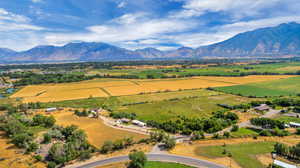 Birds eye view of property with a rural view and a mountain view